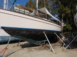 Every 2-3 years a boat needs a new application of anti fouling paint to slow barnacle growth.  I always hire yard workers to do the dirty job of sanding off the old paint and barnacles.  Three coats of paint uses 5 gallons,  at $150-$250 per gallon it gets expensive,  plus cost of hauling and boat yard space add another $400-500.  A lot of barnacle growth can slow our speed by more than half so it needs to be done.